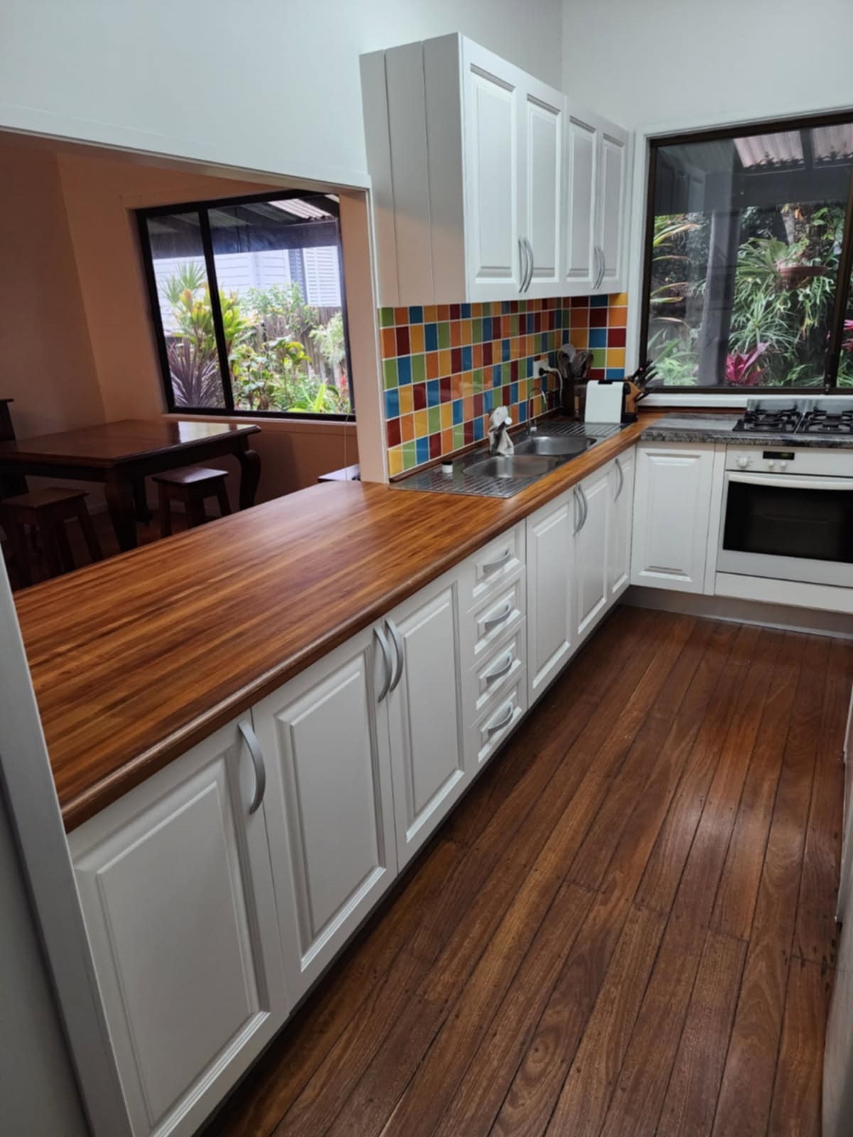 Roberto's - Timber Top, White Cupboards